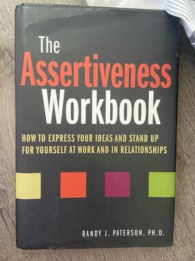 The Assertiveness Workbook by Randy J. Paterson - Black Cover